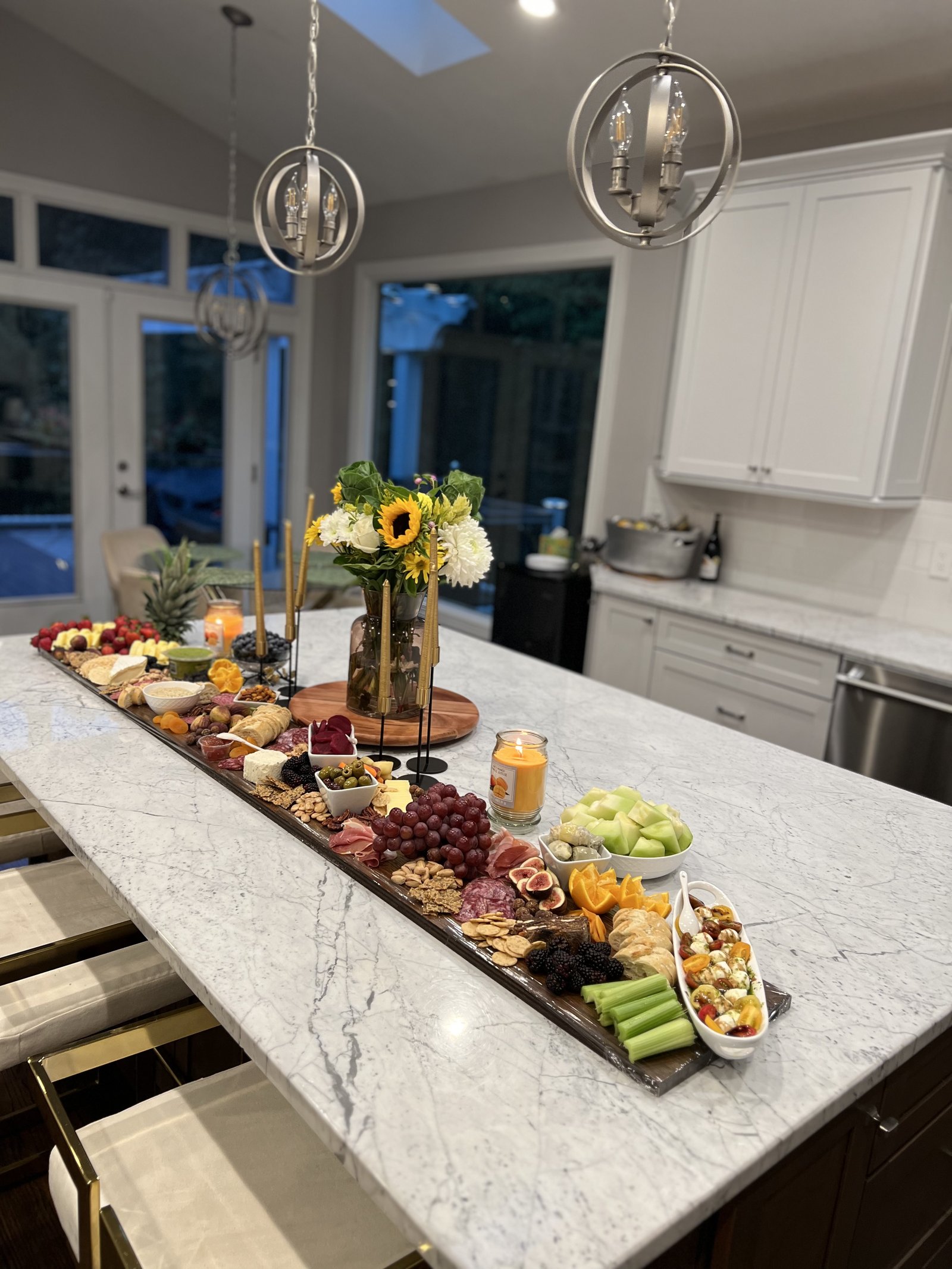 The Marble Runner — long marble table arrangement with seasonal fruits and meats